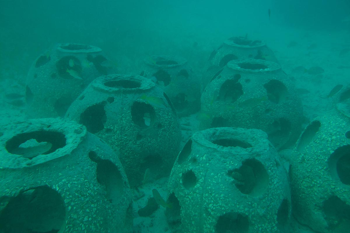 Divers controlling some reef balls